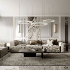 an elegant living room with marble walls and flooring