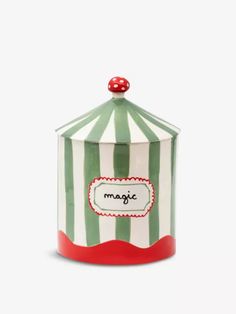 a green and white striped canister with a red lid that says magic on it