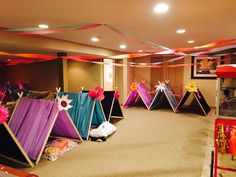 a room filled with lots of tents and decorations