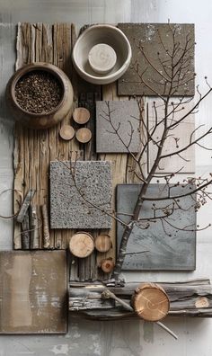 an assortment of wood and tile pieces on display with tree branches in the center,