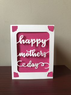 a card with the words happy mother's day written in white and pink on it