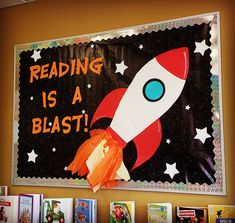 a bulletin board with an image of a rocket ship and the words reading is a blast