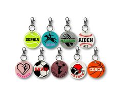 a bunch of key chains with different designs on them