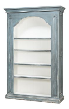 a blue bookcase with three shelves on the top and one shelf below it, against a white background