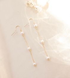 3 Pearl Drop Earring, Pearl Dangle Earring, Bridal earrings, Long chain earrings, June's birthstone Pearl, Bride to be gift, wedding earring --- made to order -- Inspired by bridal season, these freshwater pearl dangle earrings are the perfect statement piece. 3 sweet fresh water pearls embellished down our favorite sparkly chain for the most delicate accent. Details: 3 freshwater pearls, 6mm each. Drop of earring is 2.5 inches. Gold filled or sterling silver. Hypoallergenic and tarnish resistan Bridal Earrings Hair Down Gold, White Pearl Earrings With Adjustable Chain For Gift, Gift White Pearl Earrings With Adjustable Chain, Dangle Bridal Earrings With Pearl Chain, Dangle Bridal Earrings With Pearl Chain As A Gift, White Threader Earrings For Wedding, Elegant Chandelier Earrings With Adjustable Chain, Bridal Dangle Earrings With Pearl Chain Gift, Bridal Dangle Earrings With Pearl Chain