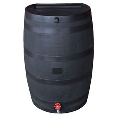 a large black barrel sitting on top of a table