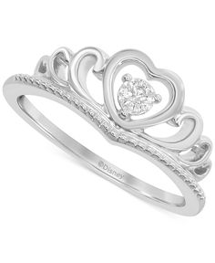 a white gold ring with a heart shaped diamond