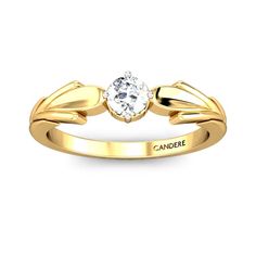 a yellow gold engagement ring with an oval diamond in the center and leaves on each side