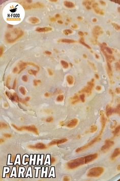 there is a white plate with food on it and the words lagha paratha