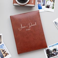 a wedding album with the name and date on it, surrounded by polaroid photos