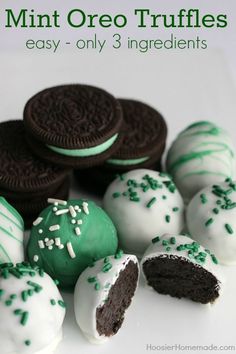 there are many cookies and chocolates on the table together, including one with green sprinkles