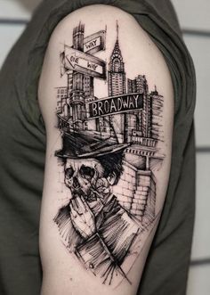 a man's arm with a black and white drawing of a skeleton wearing a hat