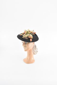 "Gorgeous 1940s straw tilt hat. Navy tilted plater with an array of milliner flowers and leave in a lovely yet slightly muted color way . Netting in front and back. Bow in back. Comes with a hat pin. Unlined. Condition | very good, light overall wear.  Measurements ✂--- Dimensions |  Best suited for 22\" or 23\" Height | about 5\" Tag | none present  ★★Visit The Shop★★ http://www.etsy.com/shop/seaofvintage ➸ Find the shop on Instagram for peekaboo sales & other earthly treasures.  Instagram | Se 1940s Hats Women, Watermelon Skirt, Harvest Dress, Berry Dress, 1940s Hats, Cocktail Hat, Stage Costume, Men Vintage, Vintage Gowns