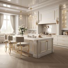 a large kitchen with white cabinets and gold trim on the counter tops, along with two bar stools