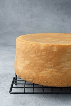 a cake sitting on top of a cooling rack