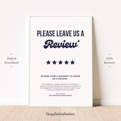 a poster with the words please leave us a review on it next to a white wall