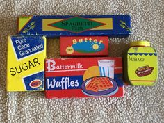 several different types of food are laid out on the carpet