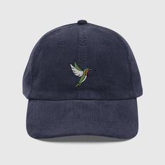 Everybody knows that dad caps are no longer just for dads, so get an embroidered cotton corduroy cap for yourself! This one's really special thanks to the intricate embroidery detail. One size fits all. - 100% cotton corduroy  -6-panel - Soft, unstructured crown - Cotton twill sweatband and taping - Adjustable corduroy strap with a silver-colored metal buckle and grommet - Tear-away label - Blank product sourced from China Processing & Shipping Times: ▸Domestic: 1-3 business days for processing and 6-9 business days for shipping. ▸International: 1-3 business days for processing and 7-12 business days for shipping. Outdoor Hut, Outdoor Hats, Embroidered Bird, Hat Embroidery, Bird Embroidery, Embroidery Gifts, Stylish Hats, Dad Caps, Embroidery Details