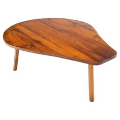 a wooden table with two legs and a triangular shape on it's top, against a white background