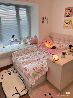 a bedroom with pink and white decor, teddy bears on the bed in front of a window