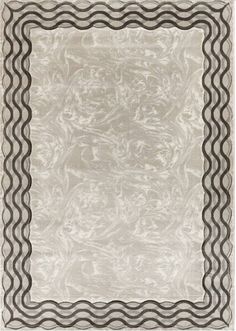 an area rug with black and white designs on the border, in front of a white background