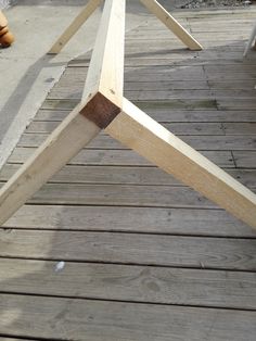 a wooden table sitting on top of a wooden floor