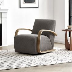 a chair sitting on top of a rug in a living room