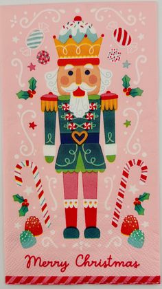 a christmas card with a nutcracker wearing a crown and holding candy canes