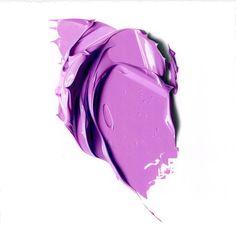 a close up view of purple paint on a white background