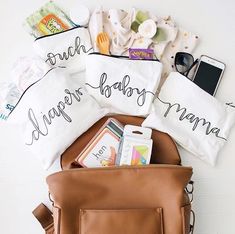 the contents of a diaper bag laid out on top of each other