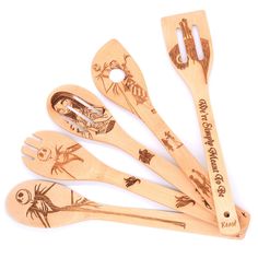 six wooden spoons with different designs on them