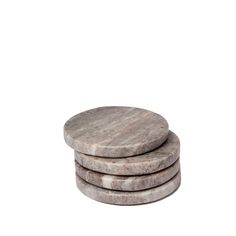 three stone coasters stacked on top of each other in front of a white background