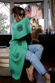 "Beautiful handmade green kimono robe, designed with cotton fabric, it flows as you move for a comfortable wear. Beach cover up, a kimono with blue evil eyes. Beach cover-up, a kimono with an evil eye design.   This is a lovely, good-quality kimono, with traditional breathable kimono sleeves.        A belt that ties around the waist. Great to wear around the house, on beaches, or to dress up with some jeans & a T-shirt, covering up on the beach with a swimsuit.         We love kimonos as they are so versatile. They also make really special & unique birthday, valentines Day, Christmas gifts, and Mother's Day gifts. The perfect combination of comfort and style, this kimono is a great addition to your new season wardrobe.    Cotton Fabric and Handmade      Length from shoulder: 115 CM Width: Boho Robes Kimonos, Luxury Elegant Green Kimono, Evil Eye Kimono, One Size Green Bohemian Kimono, Bohemian Green Kaftan With Kimono Sleeves, Green Bohemian Wrap Kaftan, Spring Cotton Tunic Kimono, Cotton Tunic Kimono For Spring, Traditional Cotton Tunic Kimono