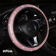 a car steering wheel cover with pink glitter