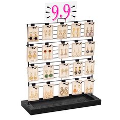 a display case with earrings and earring hooks on it's sides for 9 99