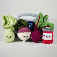 small crocheted fruits and vegetables sitting next to each other