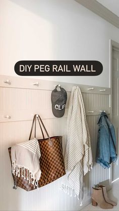 there is a coat rack on the wall next to two bags and a bag hanging from it