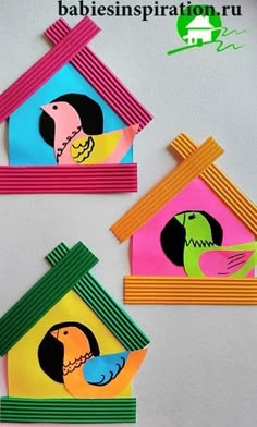 three bird houses made out of construction paper and colored construction paper with birds on them