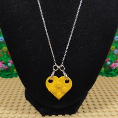 Custom handmade Heart Necklace made with genuine Lego® pieces. The Lego® heart clips on to two lobster clasps making it easy to change out the color of the heart. The two Lego® pieces are not glued together making it easy to swap one piece out with another color and making it a two color heart. The necklace chain is 20” long and 1.2mm thick with a lobster clasp. The silver plated iron makes for a shiny yet sturdy necklace. Vegas Brick Couple LLC is not affiliated with LEGO®. This product is fan Lego Heart Necklace Blue, Lego Heart Necklace, Lego Heart, Lego Pieces, Color Heart, Handmade Heart, Colorful Heart, Necklace Chain, Heart Necklace