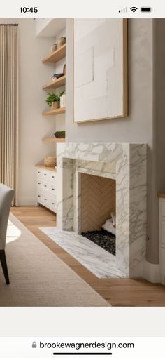 a living room filled with furniture and a fire place next to a wall mounted tv