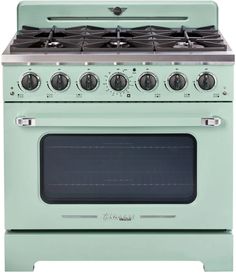 a green stove with four burners and two oven doors on the front, and one door open