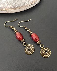 Hypoallergenic hooks  Boho dangle earrings, Red drop earrings, Ethnic earrings, Antique bronze earrings, Beaded earrings, Bohemian earrings, Boho jewellery Uk Red Brass Earrings With Ear Wire, Bronze Beaded Dangle Earrings, Bronze Dangling Beads Earrings For Gift, Bronze Earrings With Dangling Beads For Gift, Red Beaded Brass Jewelry, Red Wire Wrapped Brass Jewelry, Red Brass Wire Wrapped Jewelry, Red Copper Dangle Earrings, Red Copper Drop Earrings