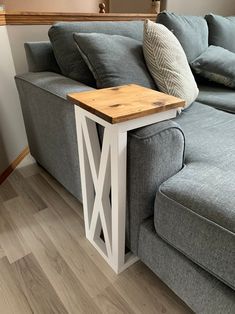 a couch with a wooden table on top of it