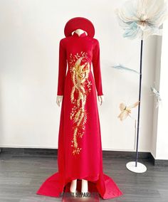 Handmade red bridal Ao Dai with finest Phoenix embroidery by yours truly.  Color :  Red and gold embroidery  Details:  Traditional Vietnamese Ao Dai  Mandarin collar Long sleeves  Zipper closing  Chapel train Silk fabric Silk pants Shop other AO DAI: https://etsy.me/3E9ppC7 Turnaround time: Due to the delicate nature of the handcrafted goods we produce this beautiful dress has creation time of approximately 6-10 weeks  Estimated shipping times : ✅Standard shipping: 3-6 weeks for most countries Red Floor-length Traditional Wear With Floral Embroidery, Red Floor-length Gown For Traditional Ceremonies, Elegant Red Traditional Wear With Floral Embroidery, Red Floral Embroidered Dresses With Traditional Drape, Red Dresses With Floral Embroidery And Traditional Drape, Traditional Red Gown With Floral Embroidery, Red Floor-length Dress With Intricate Embroidery, Traditional Red Ceremonial Dress, Ceremonial Red Dress With Traditional Drape