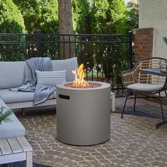 a fire pit sitting on top of a patio