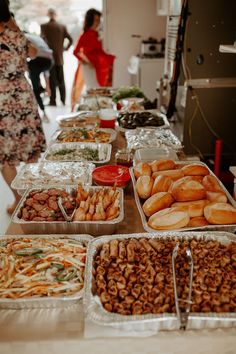 many trays of food are on the table