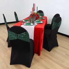 the table is set with black chairs and green sequined sashes on it