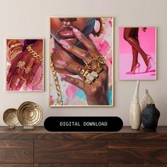 three paintings hanging on the wall above a dresser with gold jewelry and bracelets in front of them