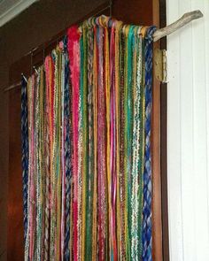 a multicolored curtain hanging from the side of a door