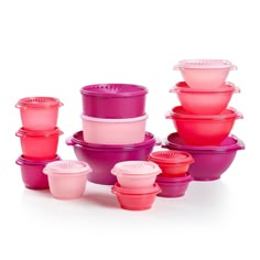 a stack of pink and purple tupperware sitting next to each other